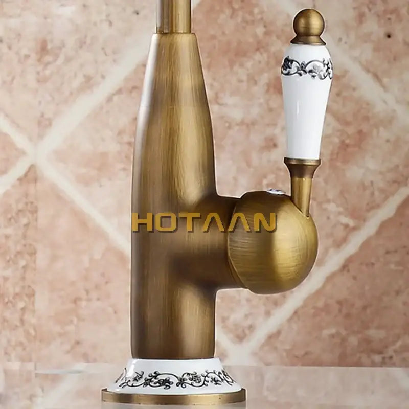 DecorBites antique brass kitchen faucet with swivel 360° rotation, white ceramic handle with black floral patterns