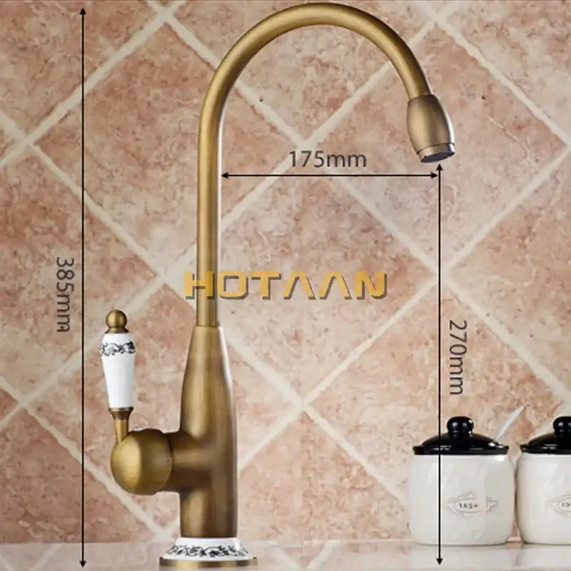 DecorBites antique brass kitchen faucet with curved spout, white ceramic handle with black floral detailing, swivel basin tap