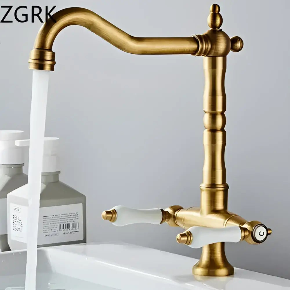 DecorBites antique brass kitchen faucet with gold-colored brass finish, white ceramic handles, and 360° rotation
