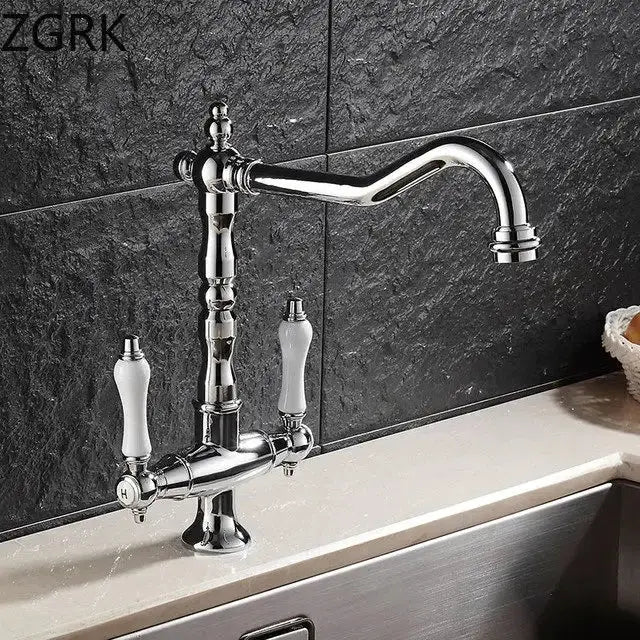 DecorBites™ antique brass kitchen faucet with chrome finish, dual white ceramic handles, ornate detailing, and 360° rotation