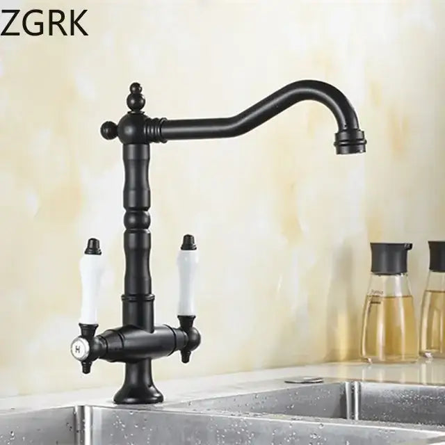 DecorBites™ antique brass kitchen faucet with black curved spout, white ceramic handles, and ornate detailing