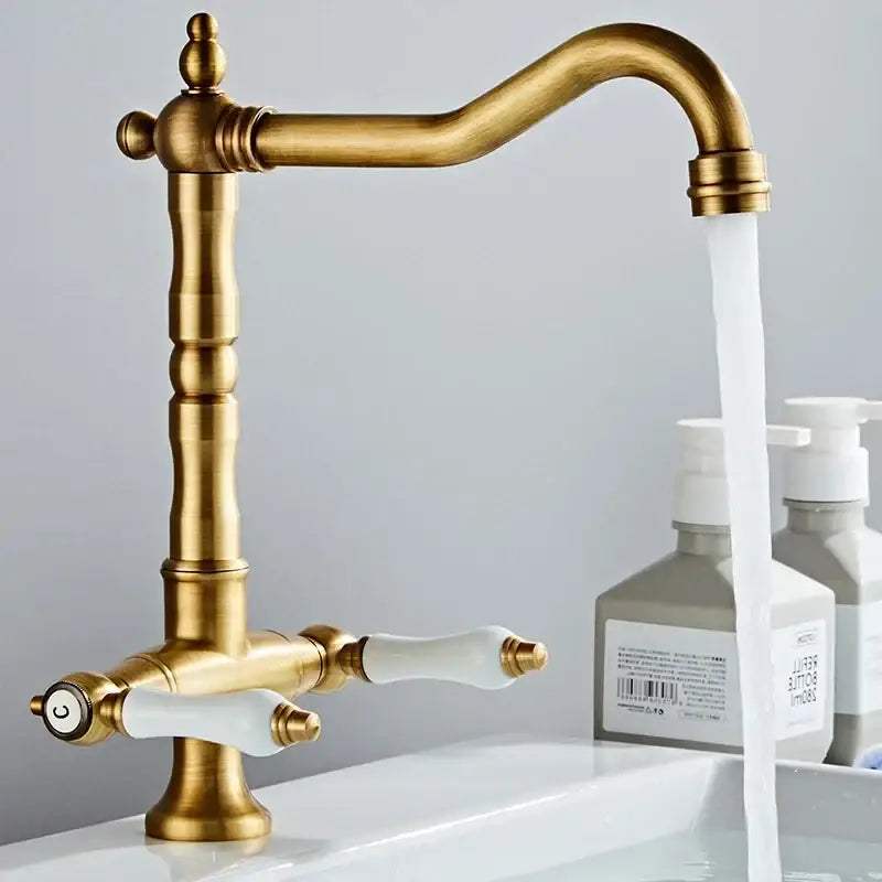 DecorBites™ antique brass kitchen faucet with elegant curved spout white ceramic handles and 360° rotation