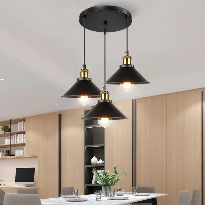 Black industrial-style pendant light with brass accents for antique brass kitchen and dining room ceiling fixture