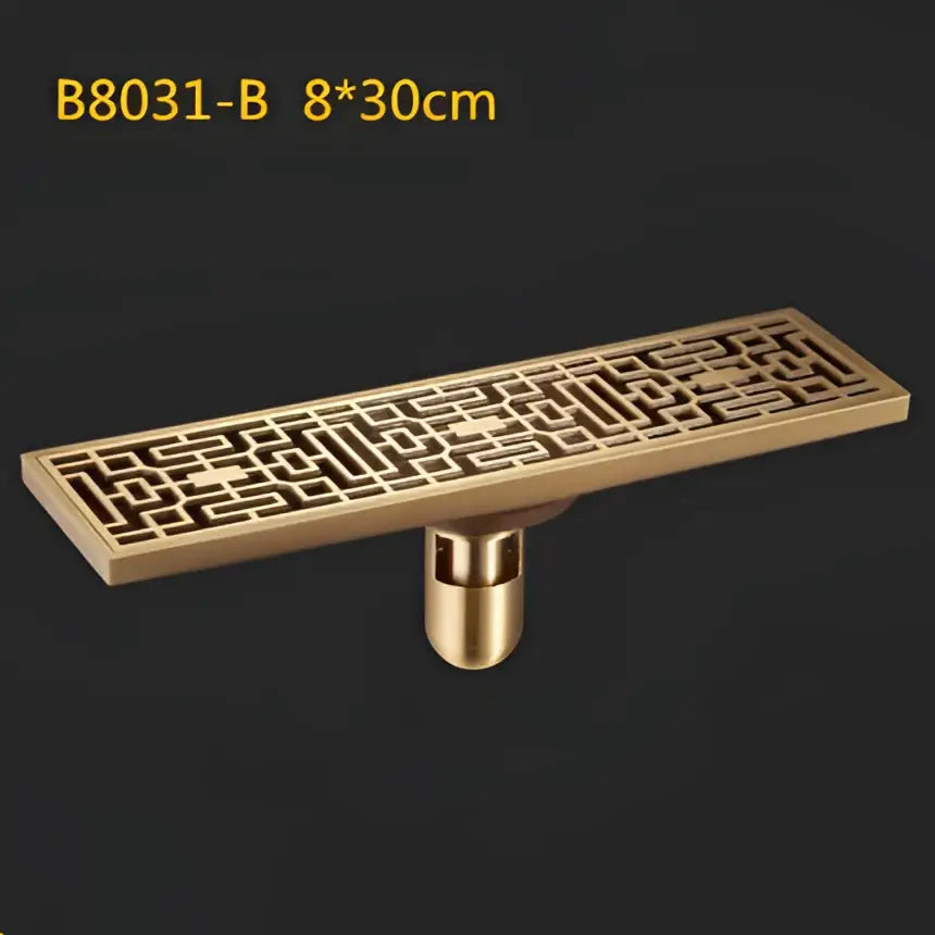 Decorbites™ antique brass linear shower floor drain with intricate brass lattice art carved cover and cylindrical base