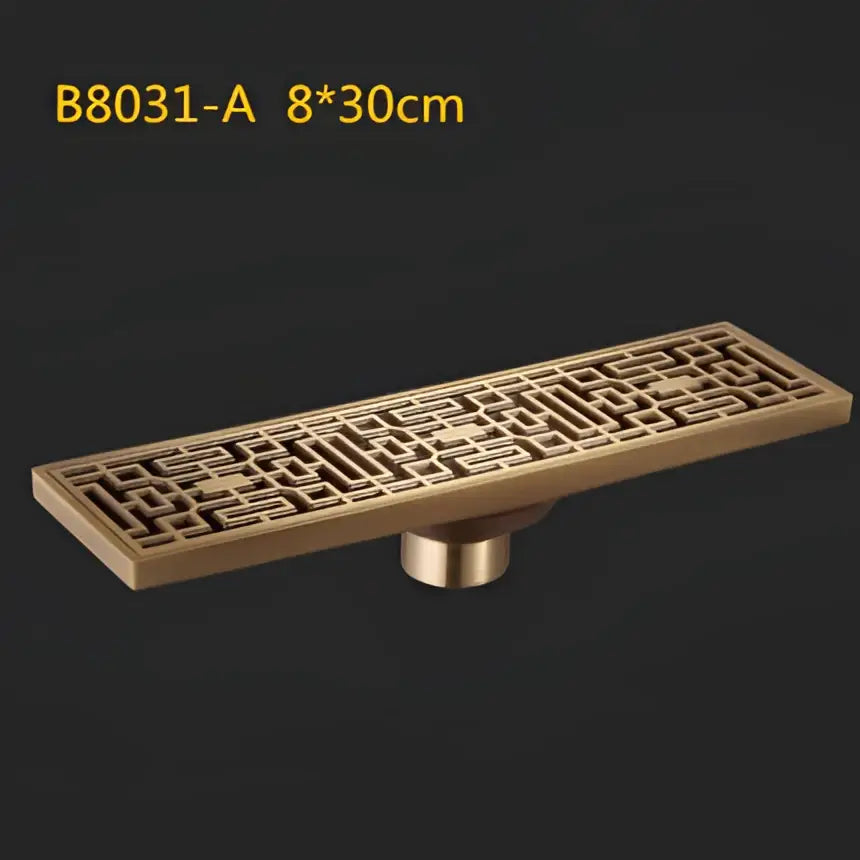 Bronze antique brass linear floor drain with intricate geometric lattice design and cylindrical base for brass linear shower use