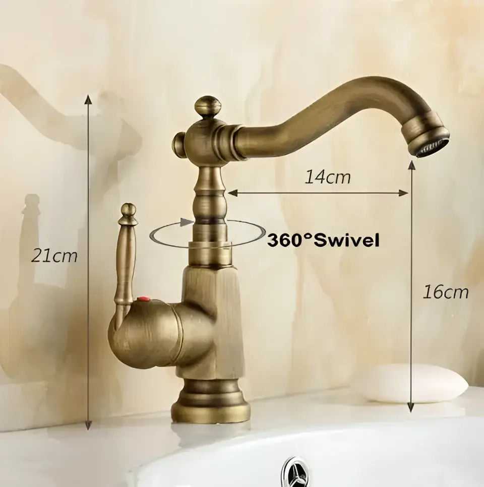 Antique brass porcelain basin mixer with 360 degree swivel spout and ornate turned-metal handle for bathroom use