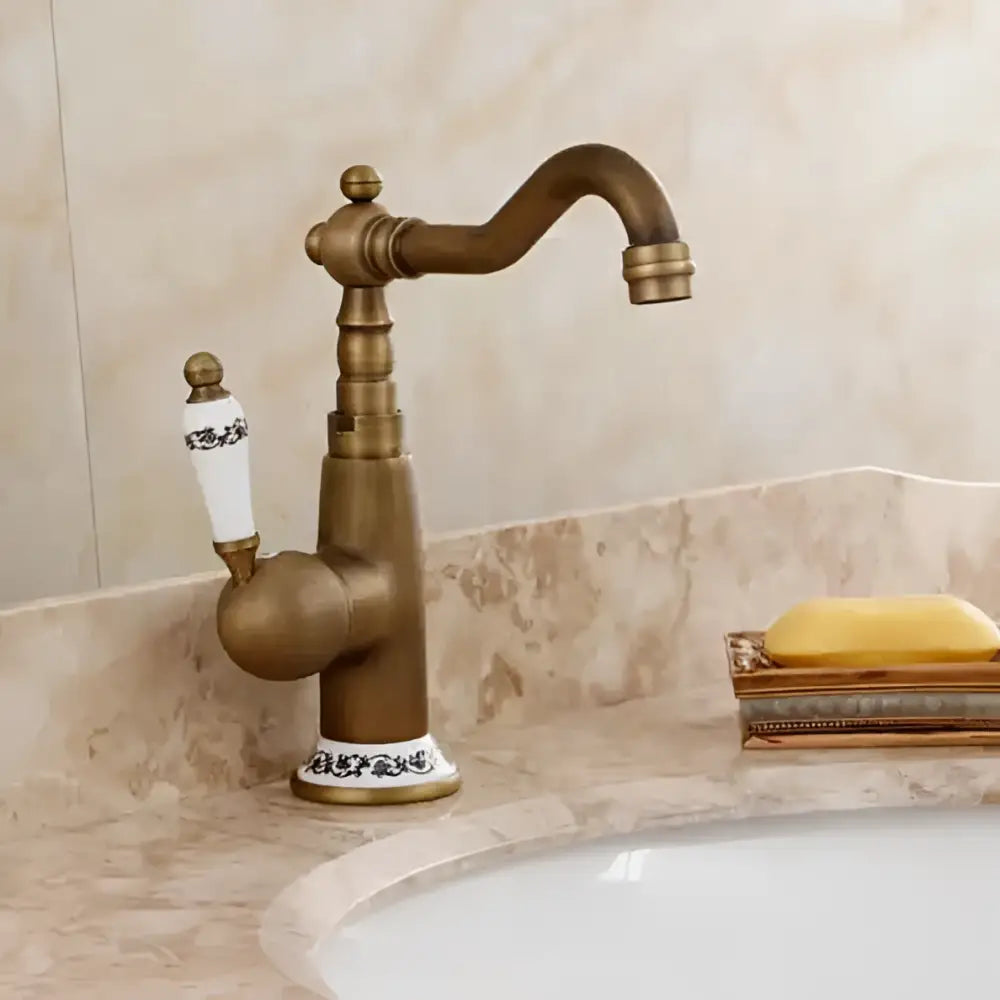 DecorBites antique brass porcelain basin mixer with white ceramic handle and ornate blue floral detailing for kitchen use