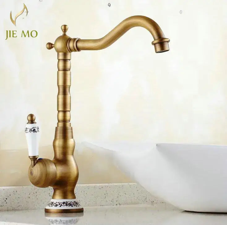 Decorbites antique brass porcelain basin mixer kitchen faucet with white ceramic handle and black floral base detailing