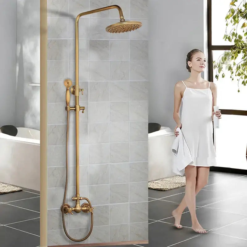 Brass-finished DecorBites™ antique brass rainfall shower faucet set with round rainhead handheld spray nozzle and shelf