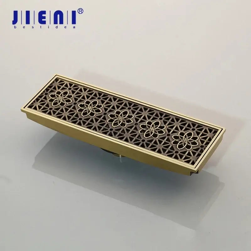 DecorBites™ antique brass floor drain strainer with intricate floral cutout design for bathroom floor deodorization