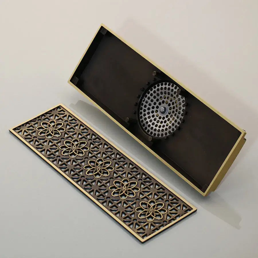 Decorbites™ antique brass floor drain strainer with brass finish and ornate floral perforated circular grate design
