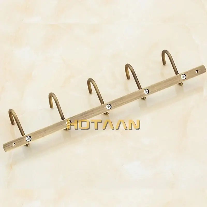 DecorBites antique brass robe hook metal coat rack with four curved hooks and decorative screws for stylish organization