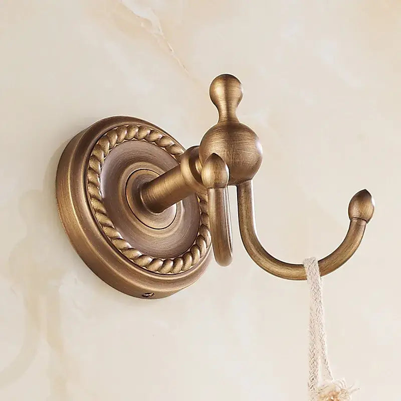 Decorbites antique brass robe hook with rope detailing and textured vintage finish for bathroom wall use