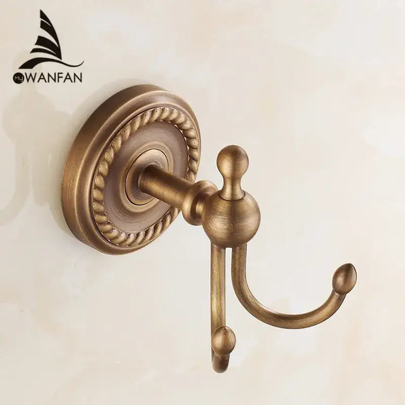 Antique brass robe hook with ornate rope-patterned base and spherical finials for wall bathroom accessories