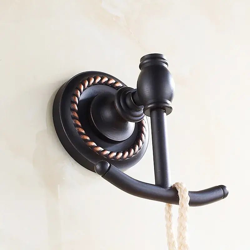Decorbites antique brass robe hook featuring a bronze finish with rope-wrapped base and dual hooks for towels