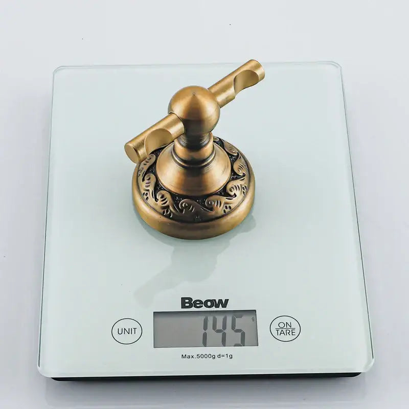 Antique brass robe hook by decorbites featuring ornate scrollwork on durable aluminium circular base bathroom accessory