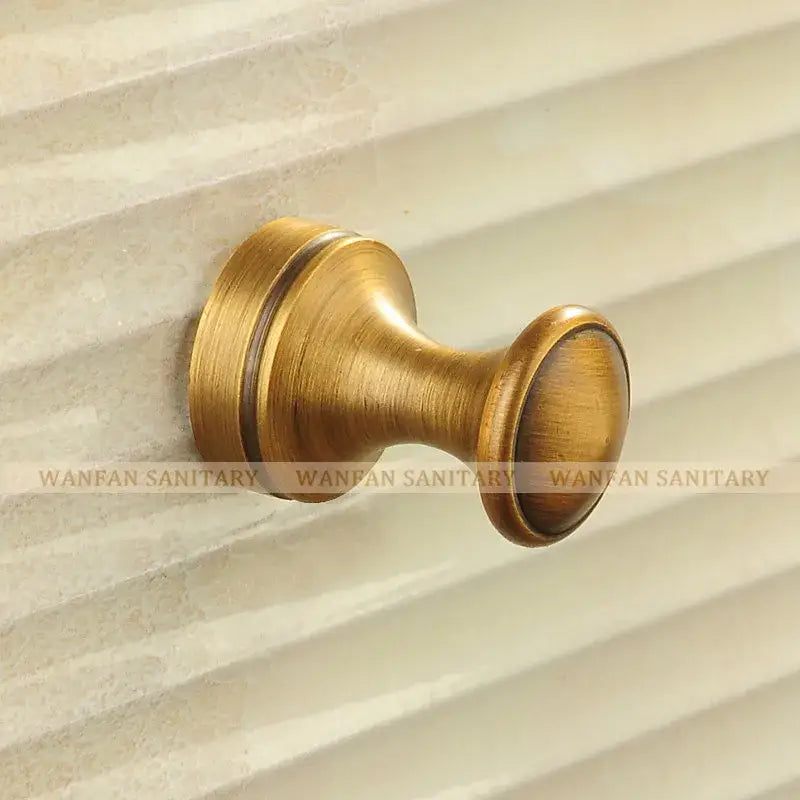 Decorbites antique brass robe hook with brass finish and classic rounded design for towels coats and clothes hanging