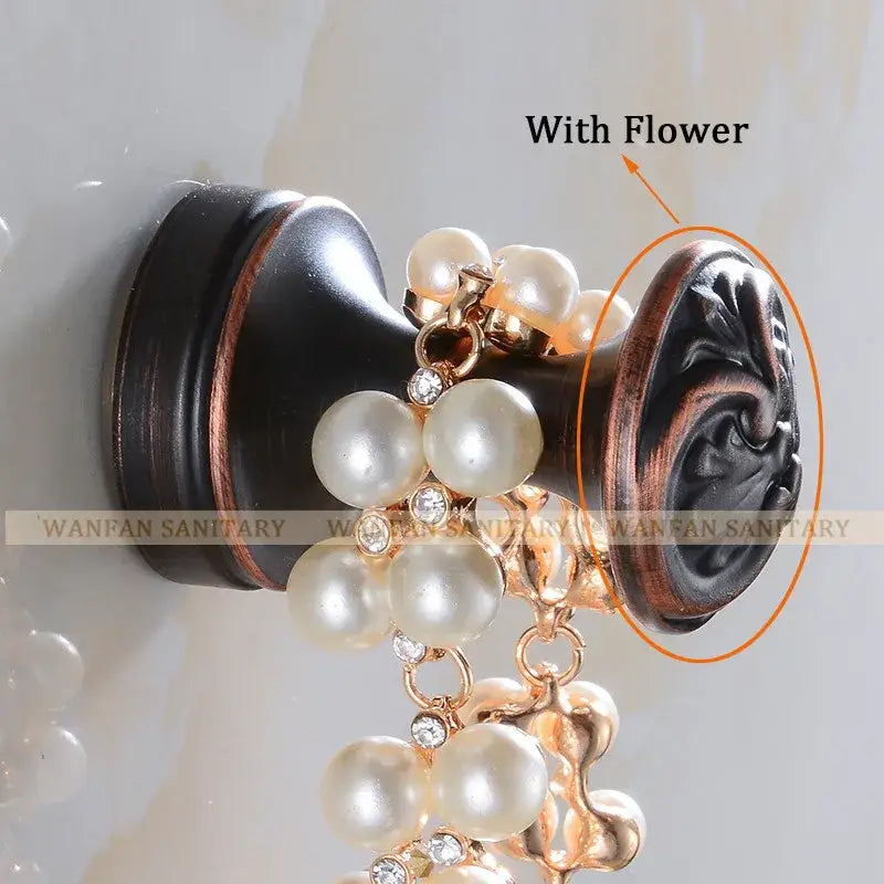 Elegant black ornate brass robe hook adorned with cream pearls and clear crystals for bathroom towels and coats
