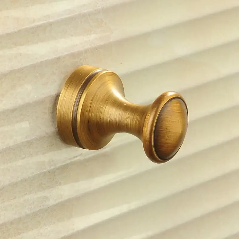Antique brass robe hook by decorbites with brushed metal finish and fluted base for towels coats or clothes