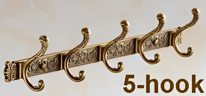 Antique brass 5-hook robe hook wall mount with ornate scrollwork and decorative panels for bathroom use