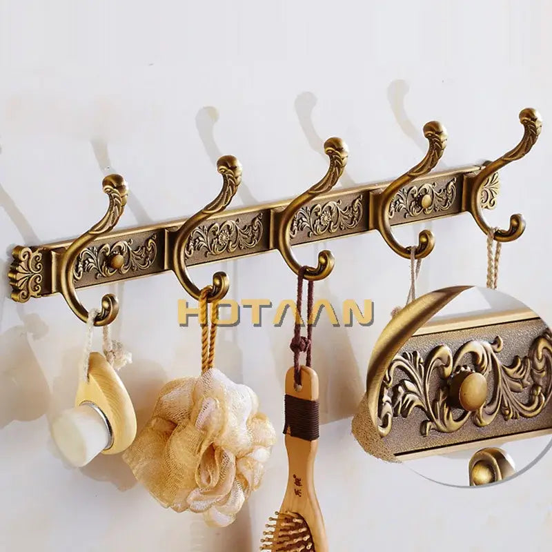 DecorBites antique brass robe hook rack with ornate floral embossing and curved hooks for wall mount