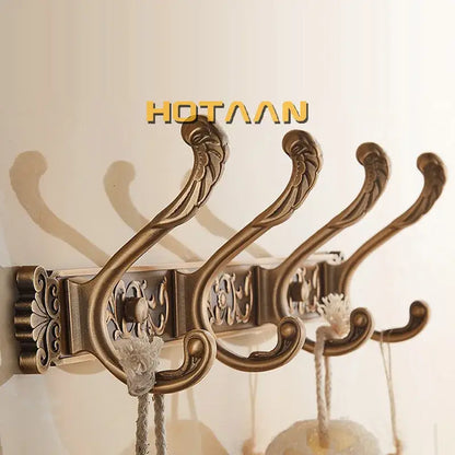 Antique brass robe hook wall mount with ornate scrollwork and floral patterns by decorbites for bathroom use