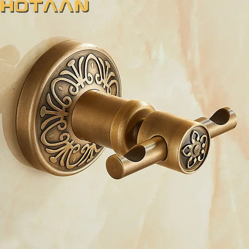 Antique brass double towel rack with ornate floral engraving for bathroom use by DecorBites™ vintage design