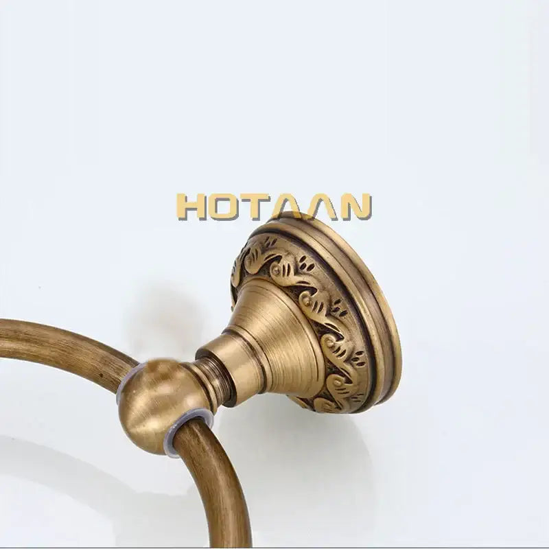 DecorBites™ antique brass round towel ring with ornate scrollwork on mounting plate for elegant bathroom use