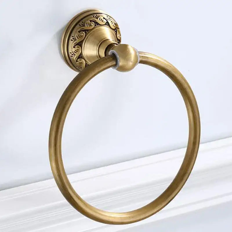 DecorBites antique brass round towel ring with ornate scrollwork on mounting plate for elegant bathroom use