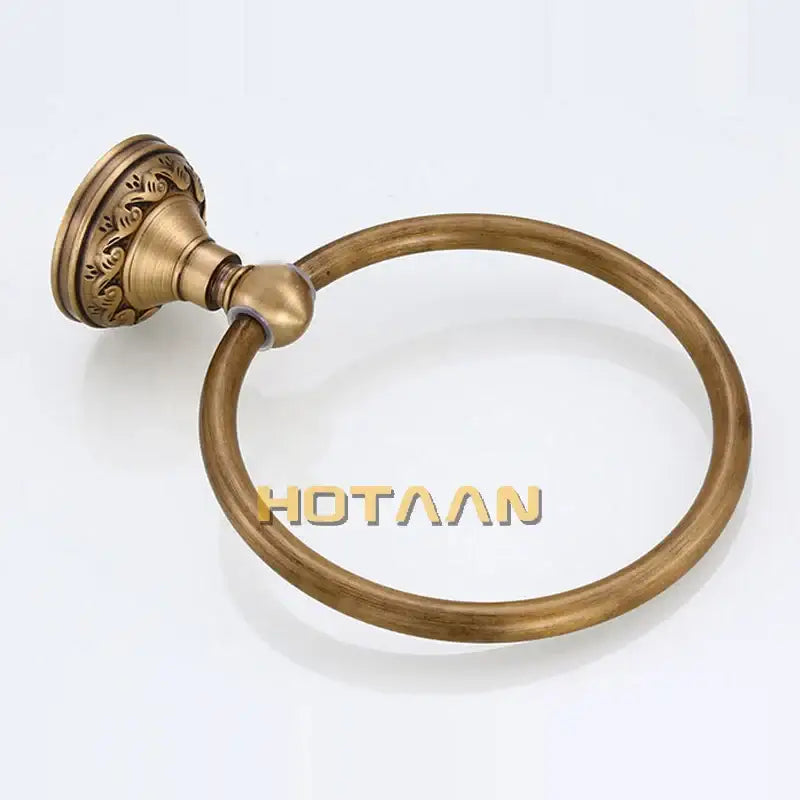 Decorbites antique brass round towel ring with ornate leaf-patterned mounting plate for elegant bathroom use
