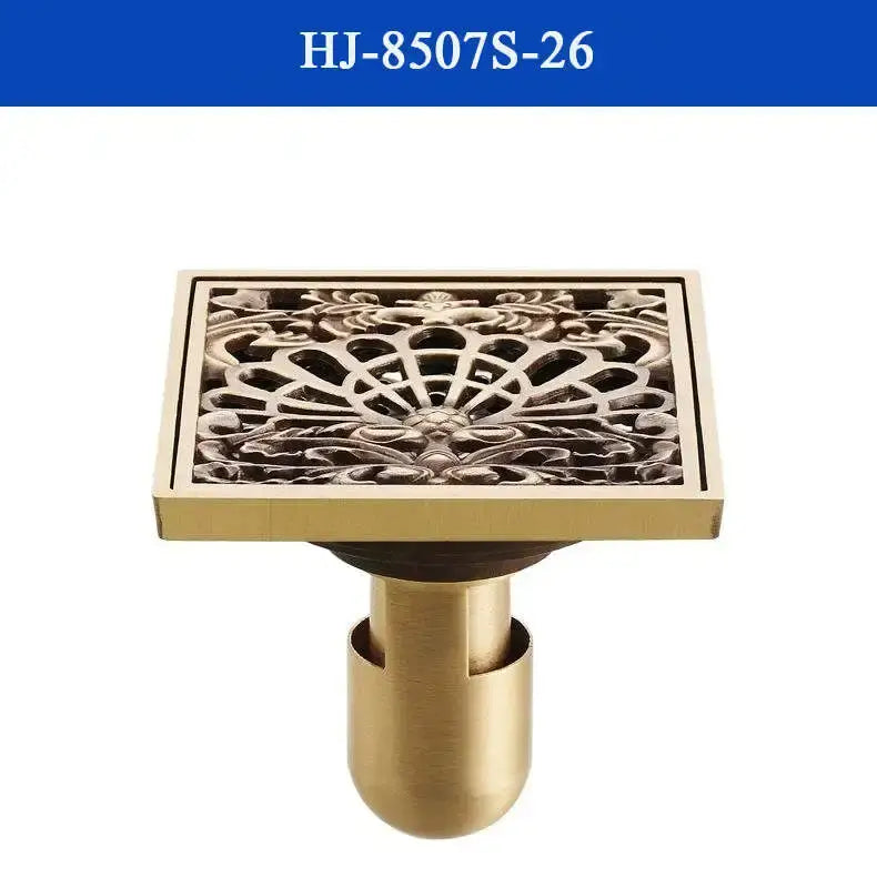 DecorBites™ antique brass shower drain cover with brass finish and intricate floral scrollwork design for bathroom use