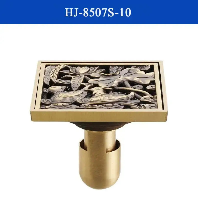 Decorbites antique brass shower drain cover with intricate embossed birds and lotus leaves design in brass shower drain