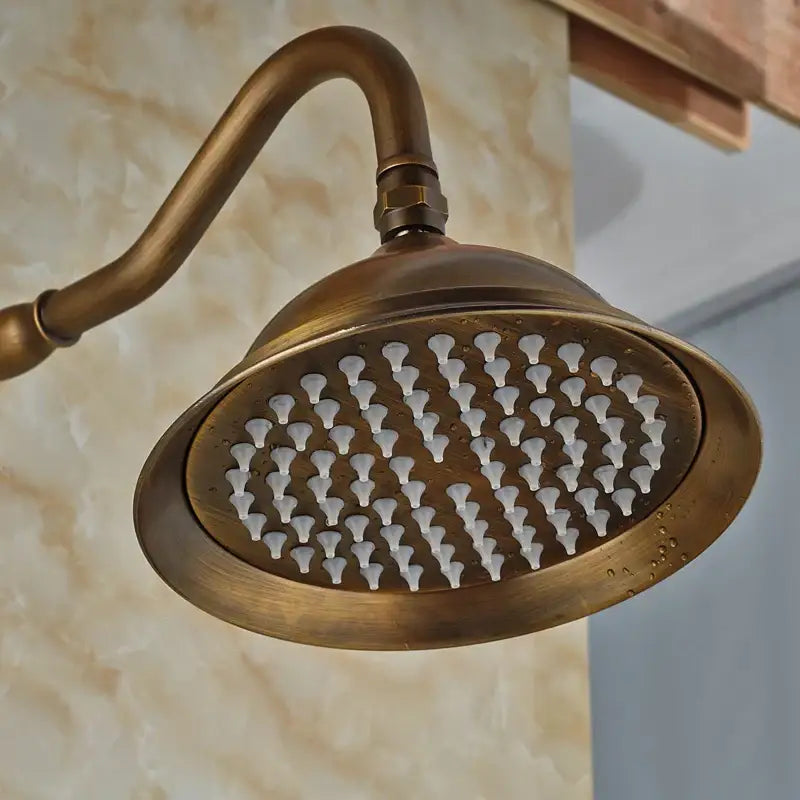 Antique brass shower faucet set with handheld includes wide oval rainfall showerhead with white plastic nozzles