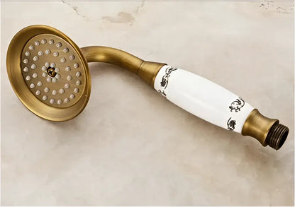 Decorbites antique brass shower faucet set with rain head featuring white ceramic and black floral detailing