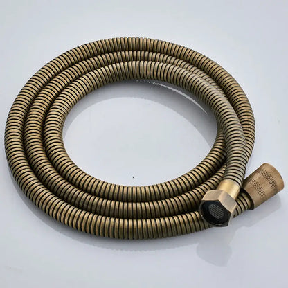 Brass-colored corrugated shower hose with hexagonal connector and textured nozzle in DecorBites antique brass shower faucet set