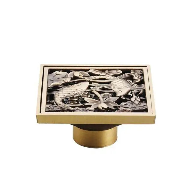 Decorbites antique brass shower floor drain with intricate fish and lotus flower engraved design 10cm square grate