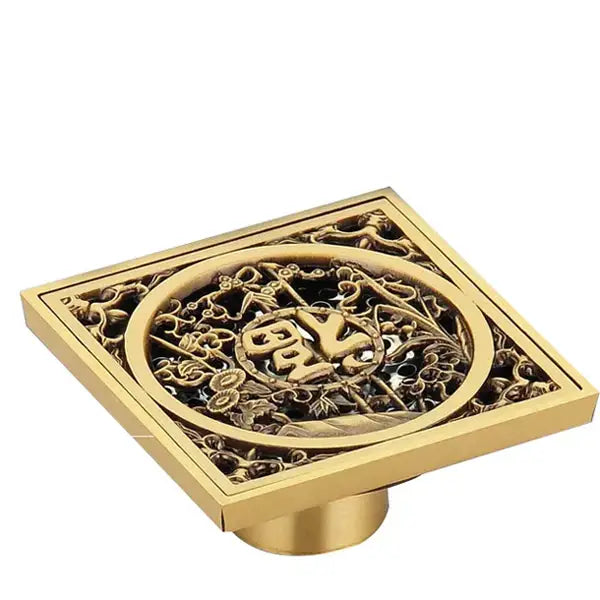 Decorbites antique brass shower floor drain with golden square filigree design and central chinese character motif