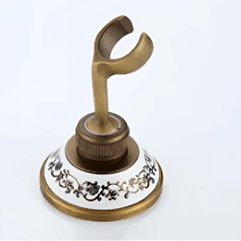 Antique brass shower set metal hook with ornate floral patterned ceramic base for decorbites shower installation