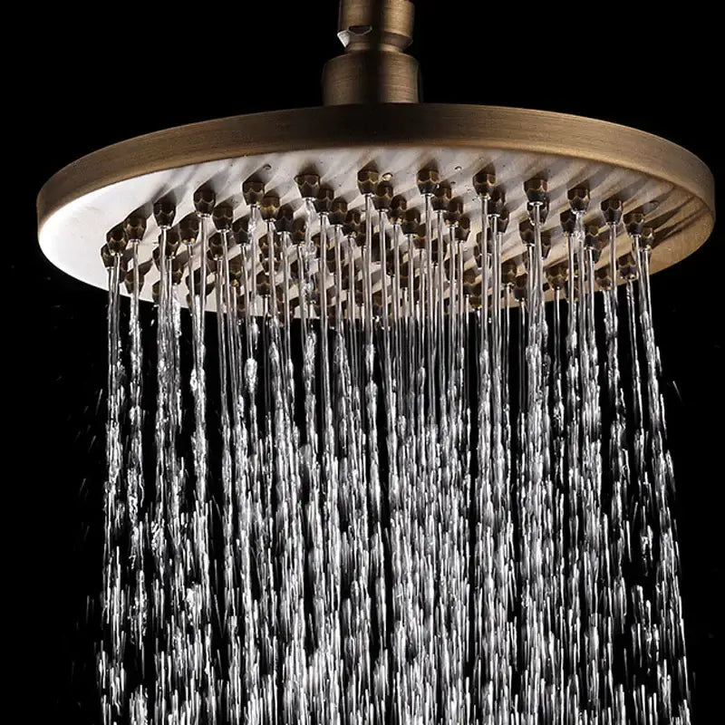 Decorbites antique brass shower set with round 8 inch rain head featuring multiple water jets in antique brass finish