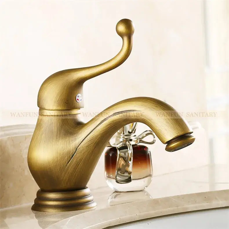 DecorBites antique brass single handle bathroom sink faucet with curved spout and ornate brass single handle design