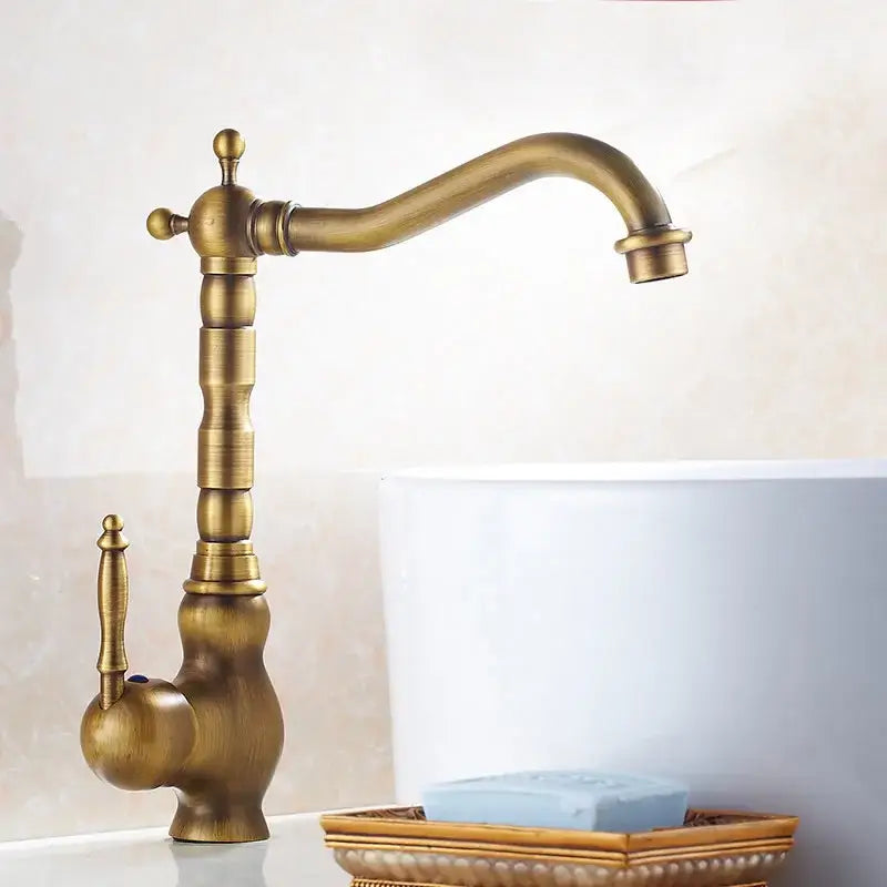 DecorBites antique brass kitchen sink faucet with ornate detailing and curved spout for hot and cold water mixing