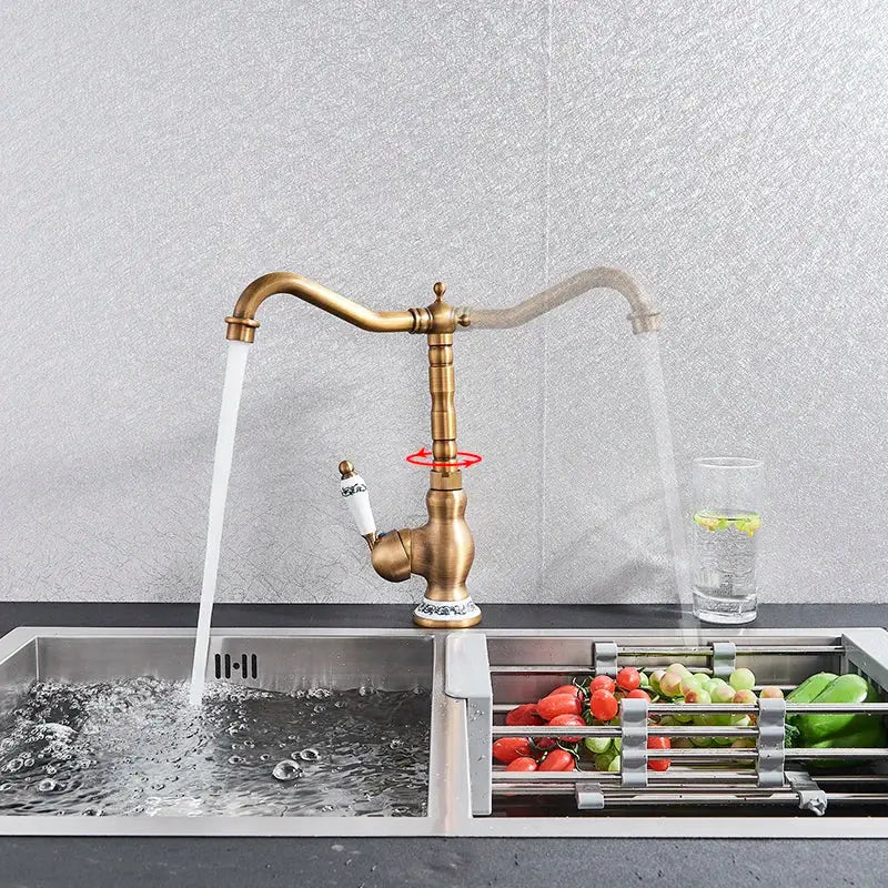DecorBites™ antique brass kitchen sink faucet with curved spout and single decorative handle for hot and cold water mixing