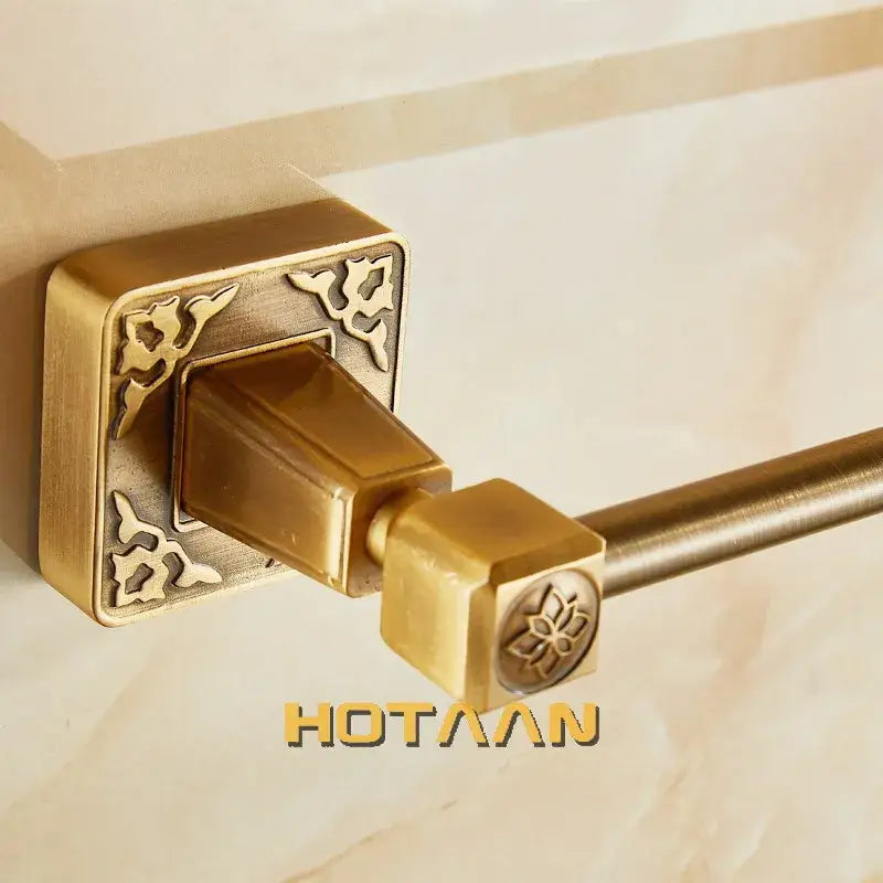 DecorBites antique brass single towel bar with brass finish and ornate floral embossing on wall mount and end cap