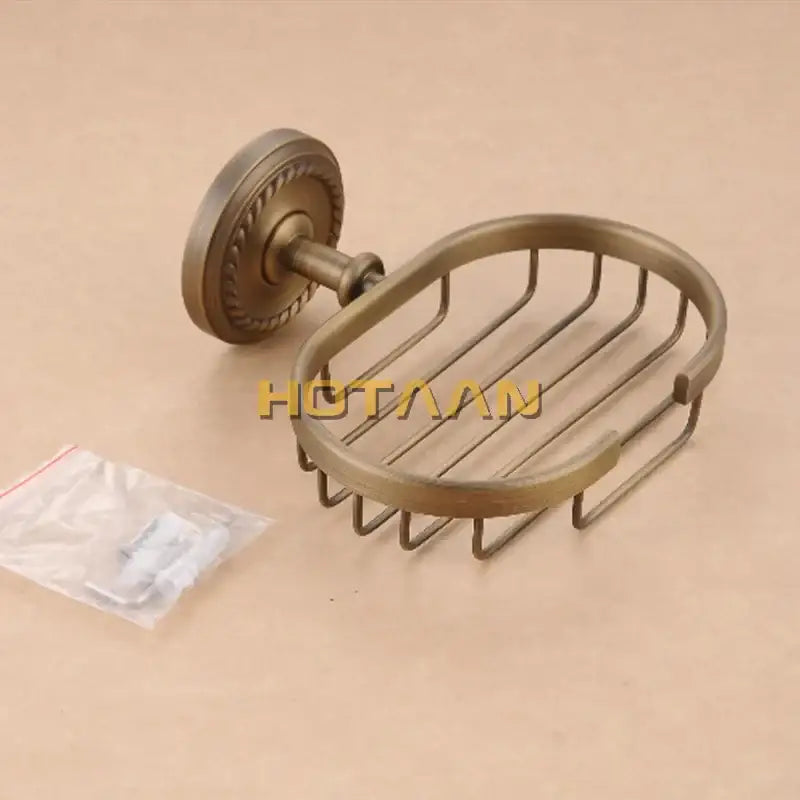 Antique brass soap holder by decorbites featuring a decorative circular wall mount and wire mesh brass soap holder design