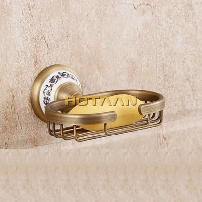 Decorbites™ antique brass soap holder with decorative white ceramic backplate featuring black floral patterns