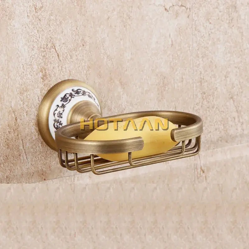 Decorbites™ antique brass soap holder with decorative white ceramic backplate featuring black floral patterns