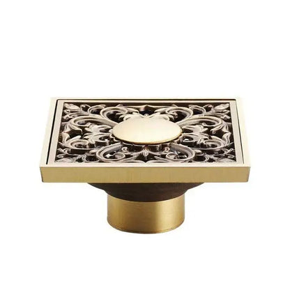 DecorBites antique brass square fish carved floor drain with floral cutout and central medallion for bathroom use