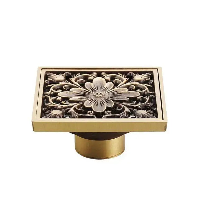 Decorbites antique brass square fish carved floor drain with intricate floral relief design for bathroom use