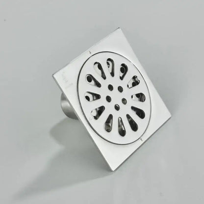 DecorBites™ antique brass square fish carved floor drain with chrome finish and circular petal patterned grate