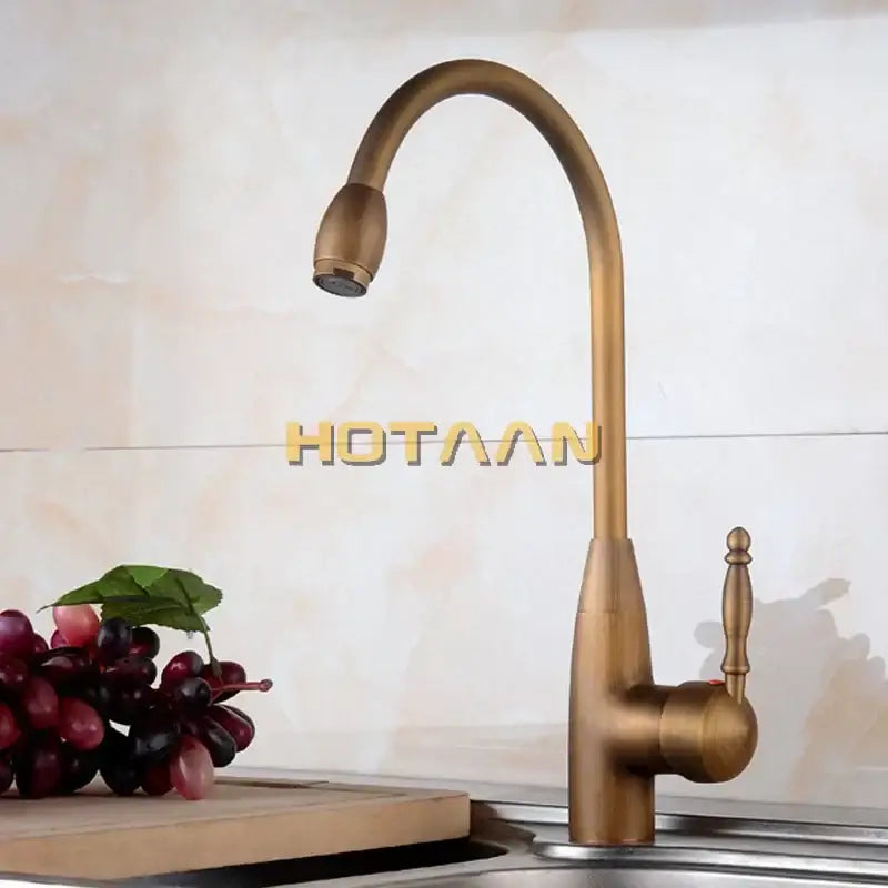 DecorBites™ antique brass swivel basin mixer tap with curved spout and ornate handle for kitchen and bathroom use